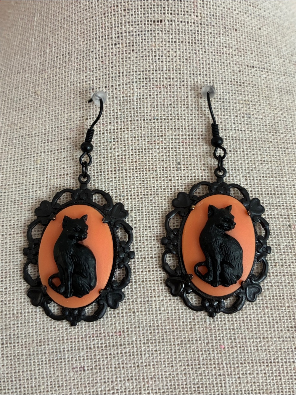 Black cat relief cameo dangle wire earrings set in ornate black tone metal